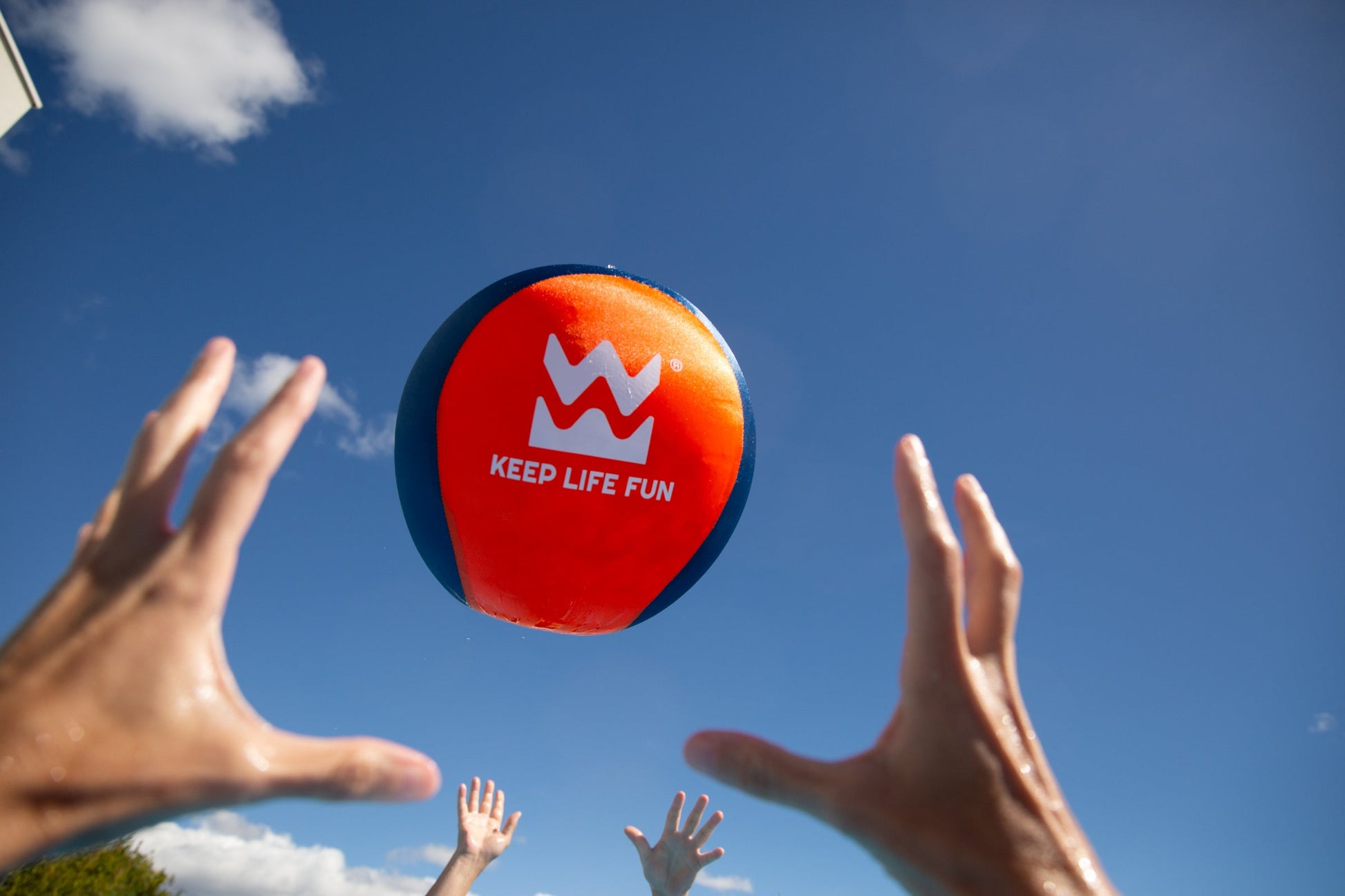 Kids playing with Waboba Jumbo Beach Ball at the beach