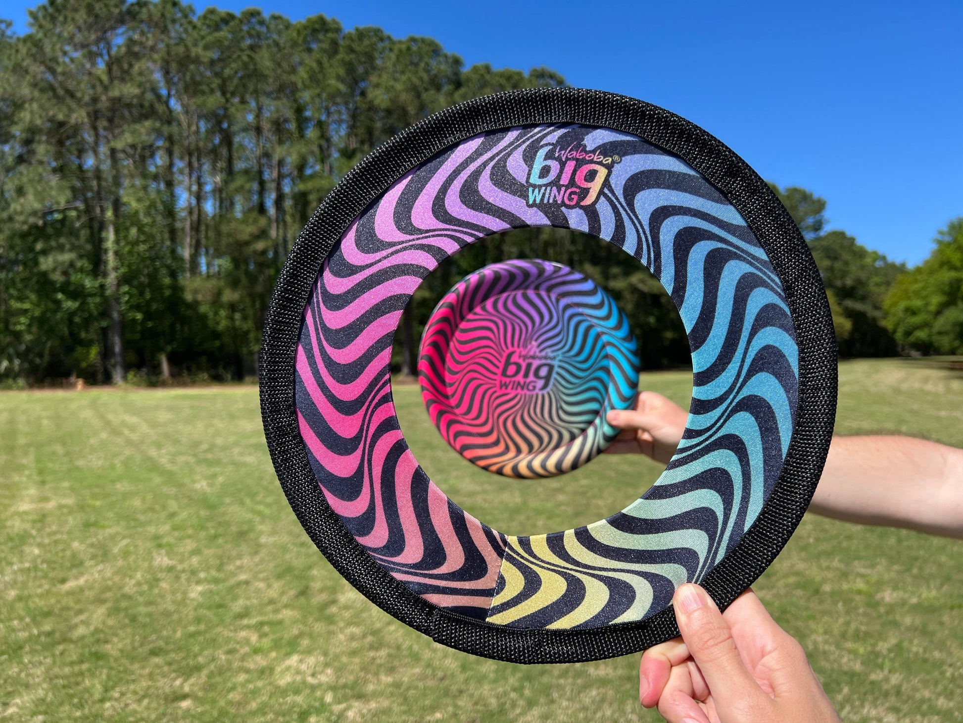 Playing with Waboba Big Wing flying disc outdoors